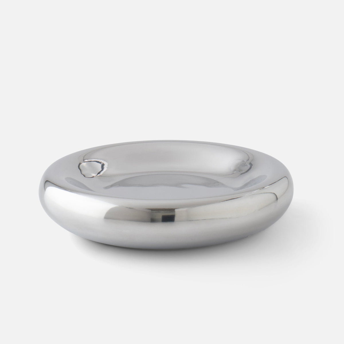 Three-quarter view of Schoolhouse x Clare V. Yves Cast Metal Catch-All showcasing its rounded aluminum dish with a light gray background