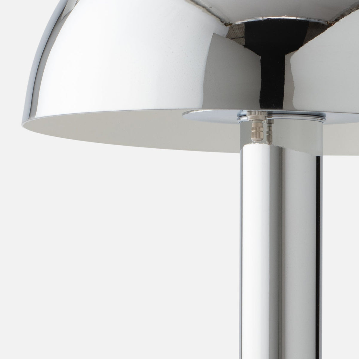 Close-up view of the Sidnie Table Lamp showcasing its chrome finish and mushroom shape against a light gray background