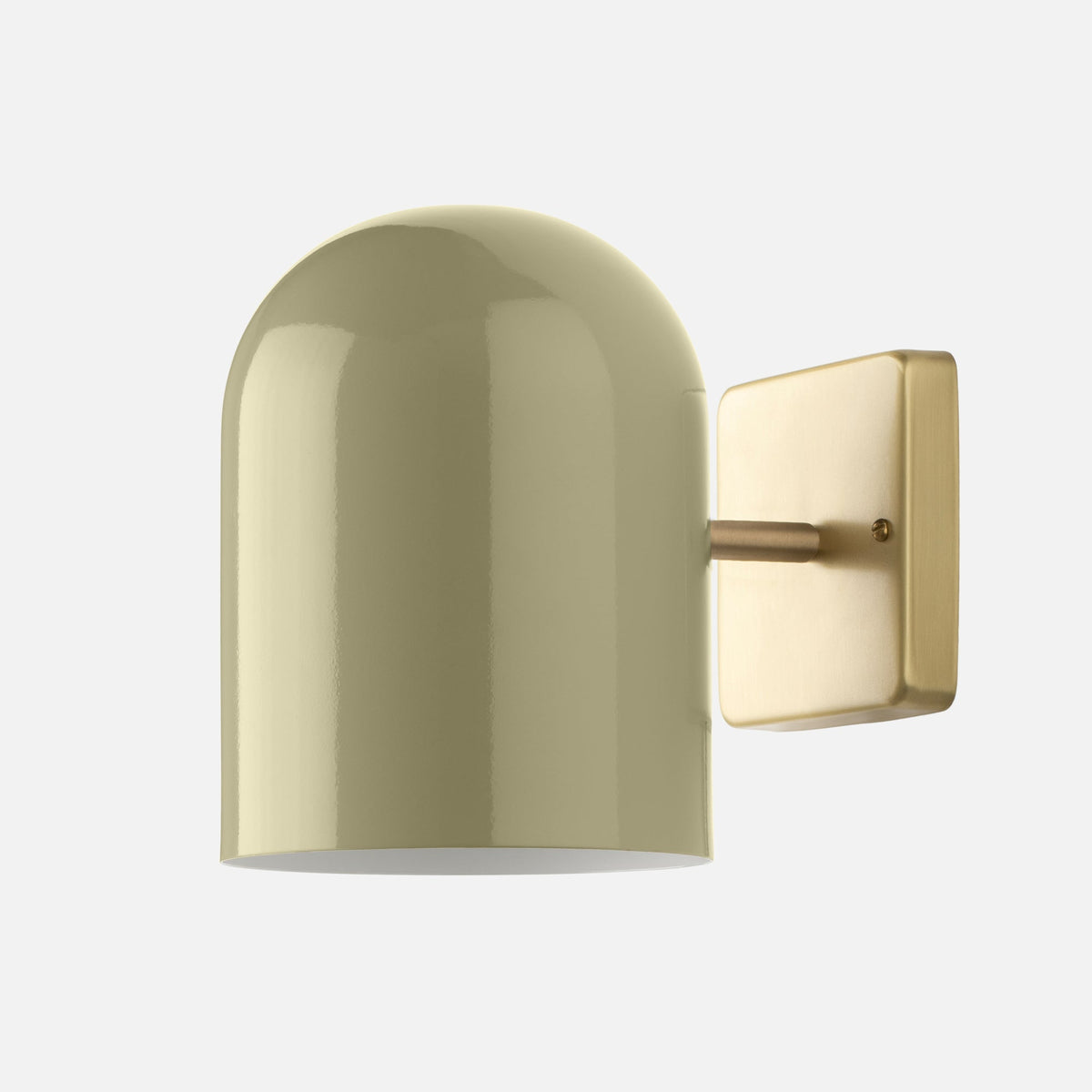 Close-up side view of Allegheny Wall Sconce showing glossy cylindrical shade and natural brass wall plate