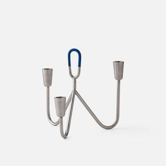 Front view of Loop Candelabra showcasing chrome finish, three candle holders, and blue loop accent with a white background