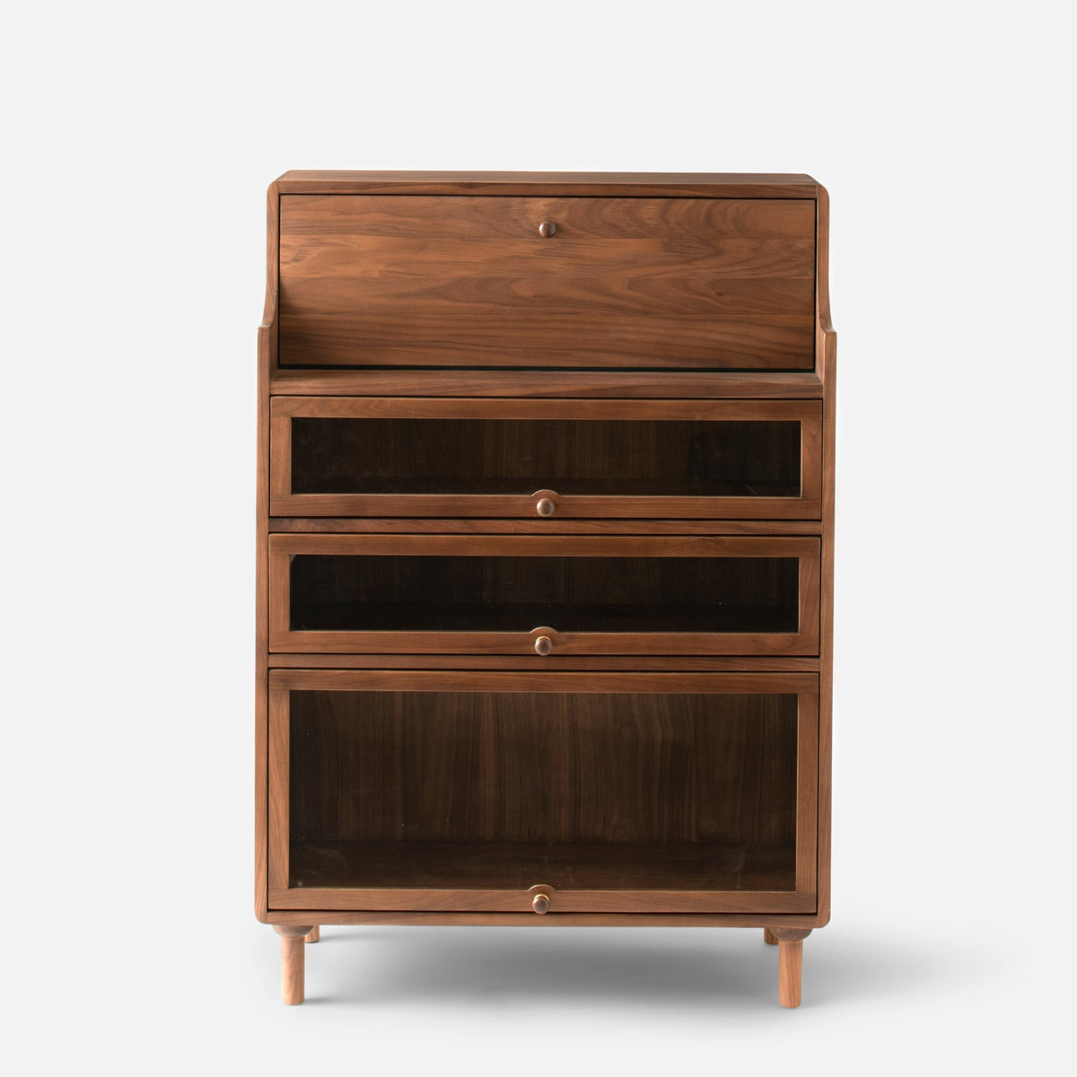 Front view of Peggy Cabinet showcasing a warm wood finish, three glass-front compartments, and tapered legs
