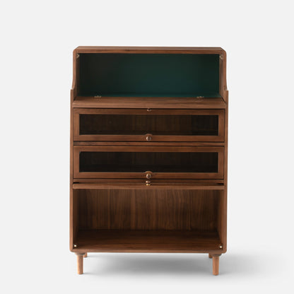 Front view of Peggy Cabinet showcasing open shelving, two drawers, lower storage compartment, and tapered legs on white background