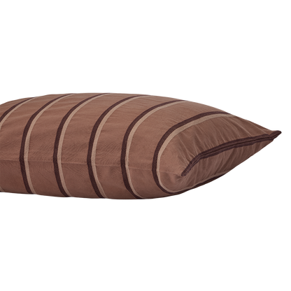 Close-up side view of Shoreline Sham showcasing brown fabric with curved dark and beige stripes on a white background