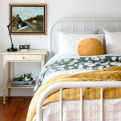 Front view of Channeled Cotton Quilt showcasing its channeled cotton texture on a neatly made bed