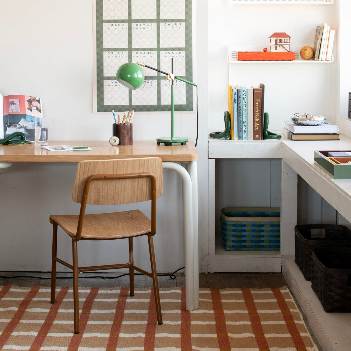 Lifestyle view of Plaid Wool Rug showcasing a tan, red, and white plaid pattern in a home office