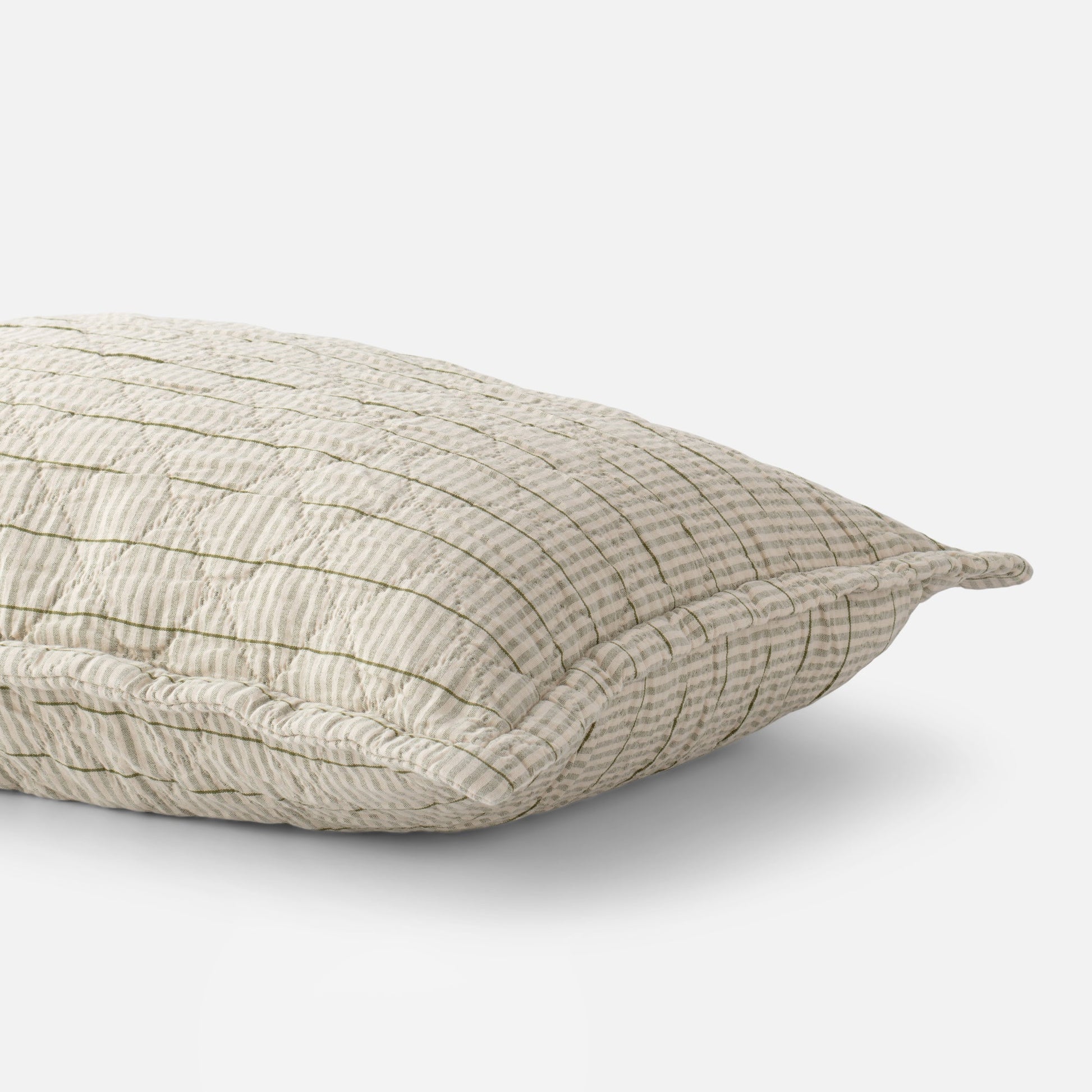 Close-up of Diamond Ticking Quilted Pillow Sham showcasing diamond quilting and olive ticking stripes with white background