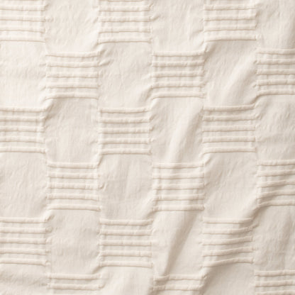 Close-up of Woven Tally Duvet Cover showcasing natural-colored woven pintuck stripes and ribbed texture