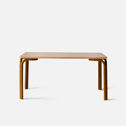 Front view of Forma Dining Table showing light oak tabletop and rounded mustard metal legs on white background