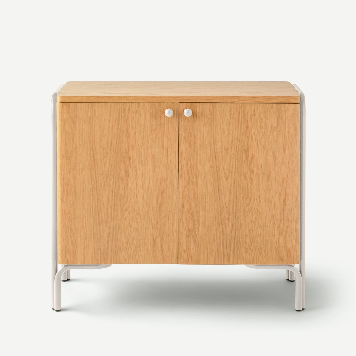 Front view of Forma Cabinet showing natural oak double doors, white round knobs, and white metal frame on white background