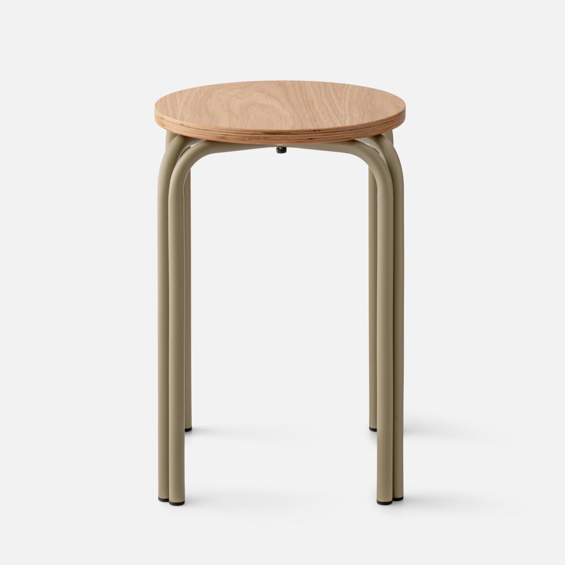 Front view of Forma Stool showcasing round white oak top with exposed plywood edge and matte olive steel legs on light background