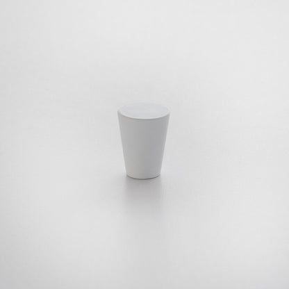 Front view of Newberg knob showcasing tapered conical shape and matte white finish on a light textured background