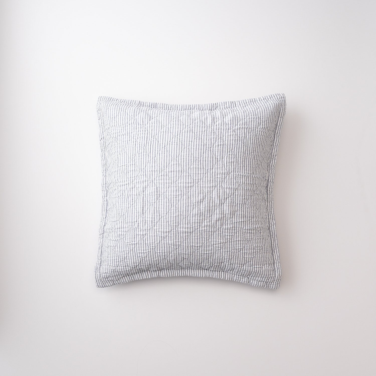 Front view of Diamond Ticking Quilted Pillow Sham showing narrow gray ticking stripes and diamond quilting on a white background