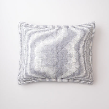 Front view of Diamond Ticking Quilted Pillow Sham with gray-and-white ticking stripes and diamond quilting on white