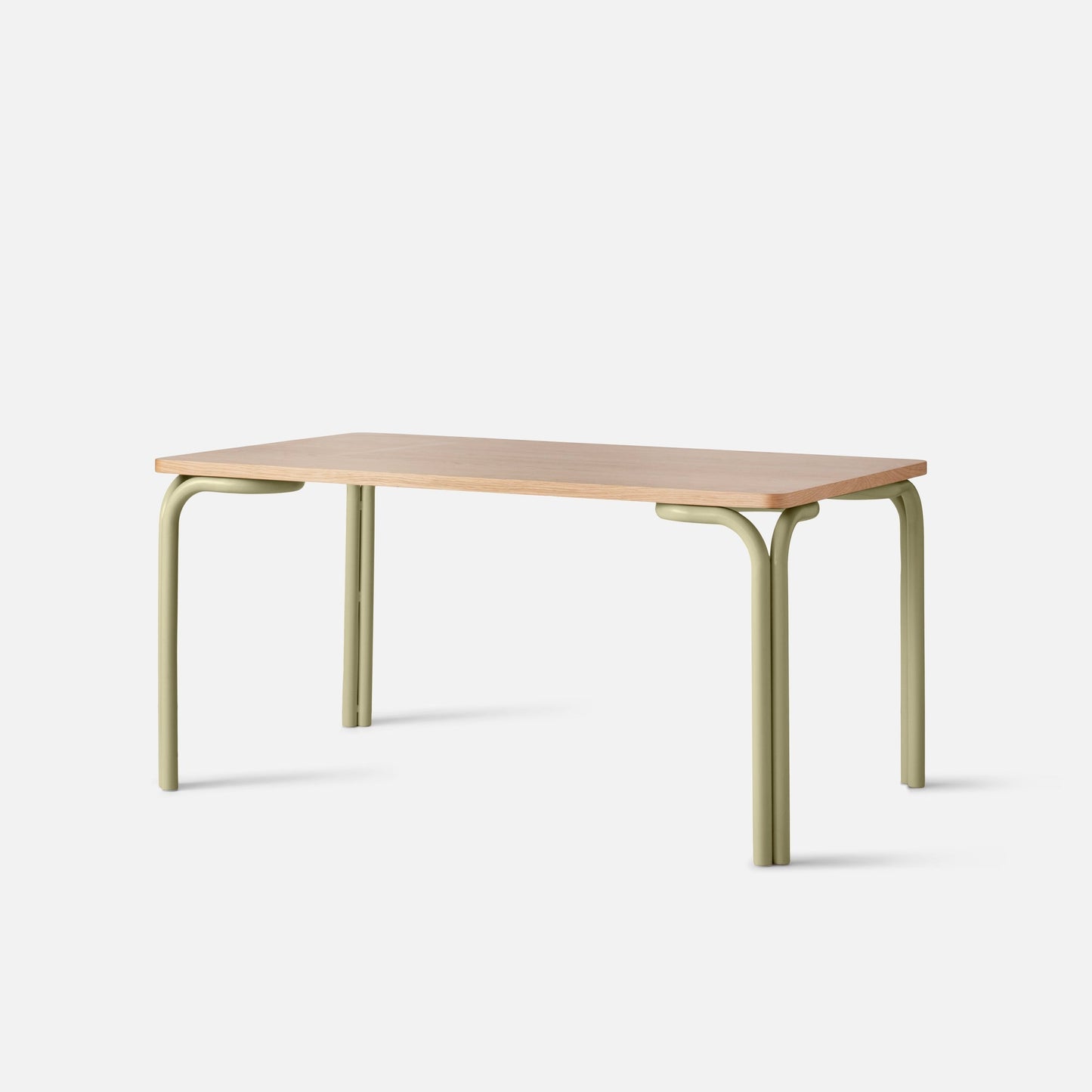 Front view of Forma Dining Table showcasing light wood top and sage-green rounded metal legs on white background