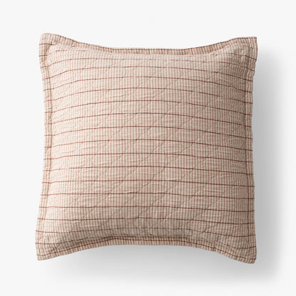 Overhead of Diamond Ticking Quilted Pillow Sham showing narrow pink and cream ticking stripes and horizontal quilting