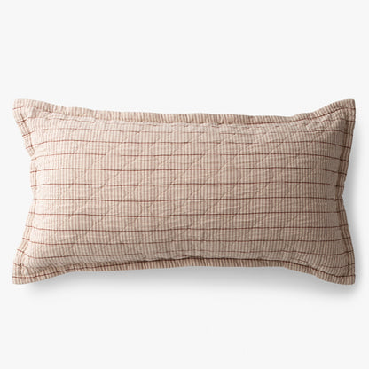 Overhead view of Diamond Ticking quilted pillow sham with beige ticking stripes and thin red lines on white