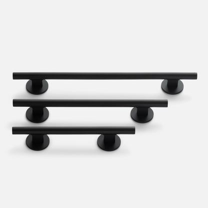Angled view of Galley Pull set in three sizes showcasing matte black tubular bars with round mounts on a light gray background